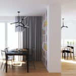 Lampa wisząca Sticks 10xG9 w kolorze czarnym, z geometrycznym kształtem, zawieszona w nowoczesnej aranżacji. Widoczne elementy metalowe i białe akcenty świetlne. Otoczenie: stół z krzesłami, zasłony, regał z książkami.