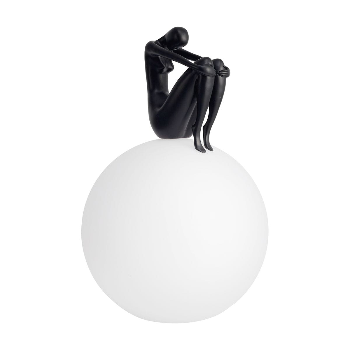 Lampa stołowa Woman-2 z czarną figurką kobiety siedzącej na białej, okrągłej podstawie. Figurka ma gładką, matową powierzchnię, a całość ma nowoczesny, minimalistyczny design. Idealna do stylowych wnętrz.