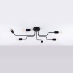 Czarna lampa sufitowa Vector z sześcioma oprawami E27, o minimalistycznym designie. Ułożona płasko, z wygiętymi ramionami, które rozprzestrzeniają światło. Widoczne żarówki w stylu retro w metalowych mocowaniach.