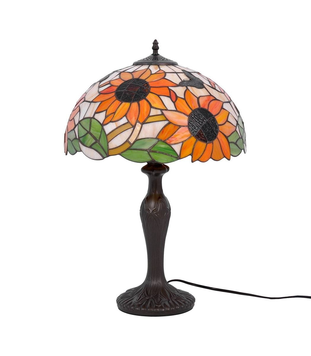 Lampa stołowa Sunflower z kloszem w kolorze multikolorowym, ozdobiona motywem słoneczników. Podstawa metalowa w ciemnym kolorze, o eleganckim wzorze. Ujęcie z boku, ukazujące detal klosza oraz strukturę podstawy.