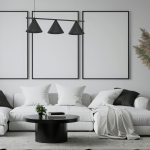 Lampa wisząca Capital w kolorze czarnym z trzema stożkowymi kloszami, zawieszona nad okrągłym stołem w nowoczesnym wnętrzu. Klosze są matowe, a lampa umieszczona w minimalistycznym pomieszczeniu z białą sofą i dekoracjami.