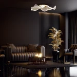 Largo lampa sufitowa 1xLED/16W w kolorze złotym, o falistej formie, zamontowana na suficie. W tle elegancki, ciemny salon z sofą i rośliną w doniczce, stwarzającym nowoczesną atmosferę.