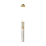 Lampa wisząca Aria z mosiądzu, z przezroczystym kloszem w formie cylindrycznej, zawieszona na cienkim przewodzie. Jedno źródło światła E14, montowana na suficie, z wykończeniem w kolorze złotym. Tło białe, co podkreśla elegancki design.