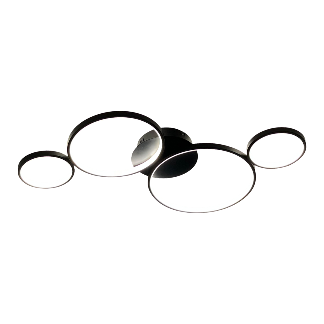 Lampa wisząca Universe z czterema okrągłymi źródłami światła LED o mocy 30W. W kolorze czarnym, z minimalistycznym designem. Ujęcie z boku, ukazujące różne średnice okręgów oraz zamocowanie do sufitu.