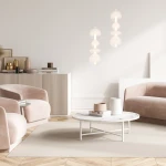 Lampa wisząca Daphne w kolorze białym z jednym źródłem LED o mocy 36W, składająca się z trzech przezroczystych kul, zawieszona w nowoczesnym wnętrzu z różowymi fotelami i okrągłym stołem na podłodze.