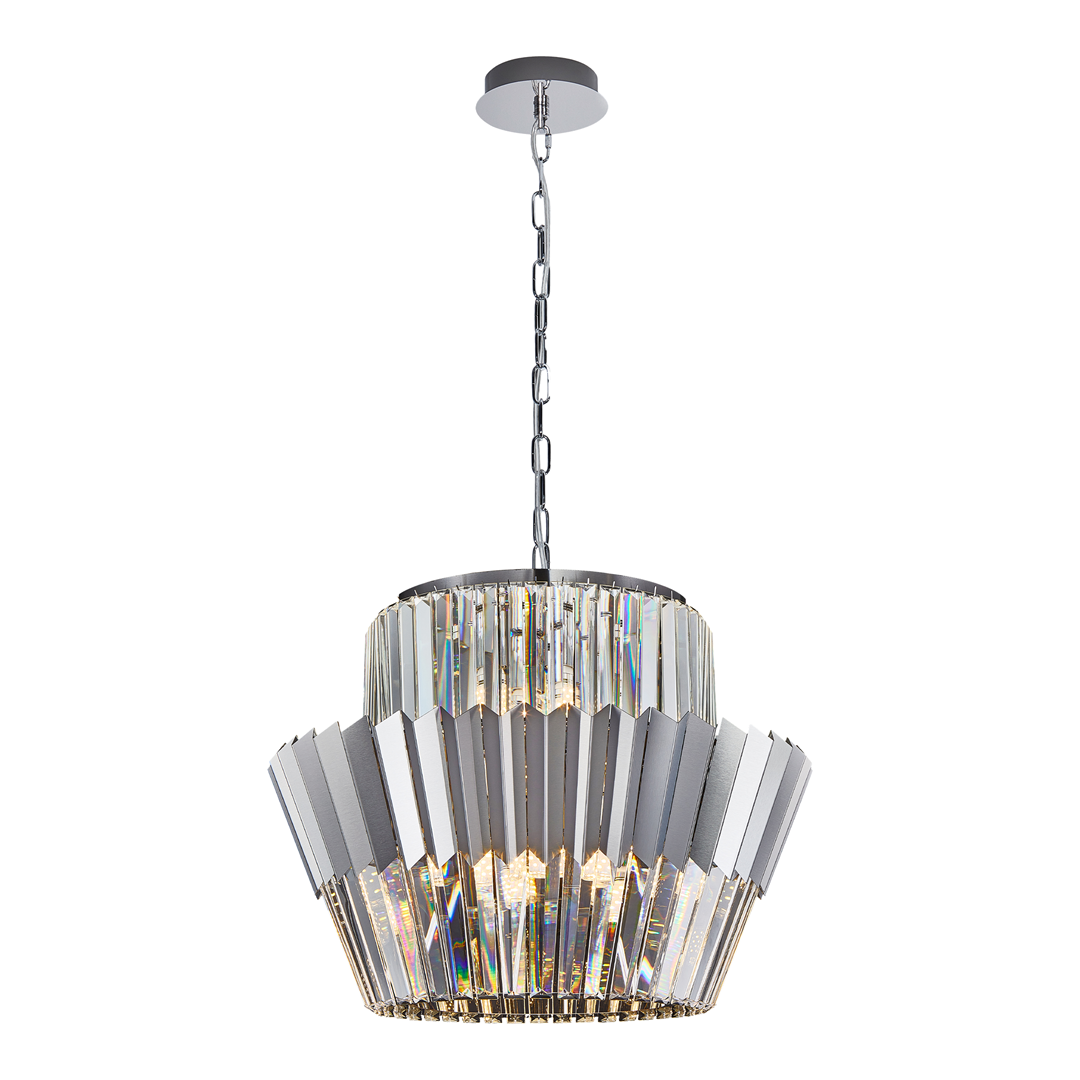Lampa wisząca Donna w kolorze chromu z 12 miejscami na żarówki E14. Posiada stożkowy kształt z przezroczystymi, wielokątnymi elementami. Zawieszona na łańcuchu, z metalowym mocowaniem sufitowym. Idealna do nowoczesnych wnętrz.