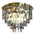 Lampa sufitowa Luxuria 9xE14 w złotym kolorze, o okrągłym kształcie. Posiada dekoracyjne kryształy w różnych kształtach, tworzące elegancki wzór, z wiszącymi elementami u dołu. Zainstalowana w pozycji wiszącej, na białym tle.