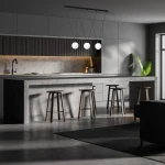 Lampa wisząca Capri 3xG9 w kolorze czarnym z białymi kloszami, zawieszona nad wyspą kuchenną. Widoczny nowoczesny design z metalową konstrukcją, w otoczeniu minimalistycznego wnętrza kuchni z betonowymi elementami i drewnianymi stołkami.