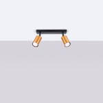 Czarna lampa sufitowa typu spot z dwoma miedzianymi oprawami na żarówki GU10. Ujęcie frontalne, lampa zamontowana na prostokątnej podstawie, oprawy skierowane w dół, na jasnym tle.