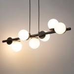 Lampa wisząca Avola z siedmioma źródłami światła G9, z czarnym metalowym stelażem i białymi, okrągłymi kloszami. Produkt zawieszony na dwóch linkach, z minimalistycznym designem, idealny do nowoczesnych wnętrz.