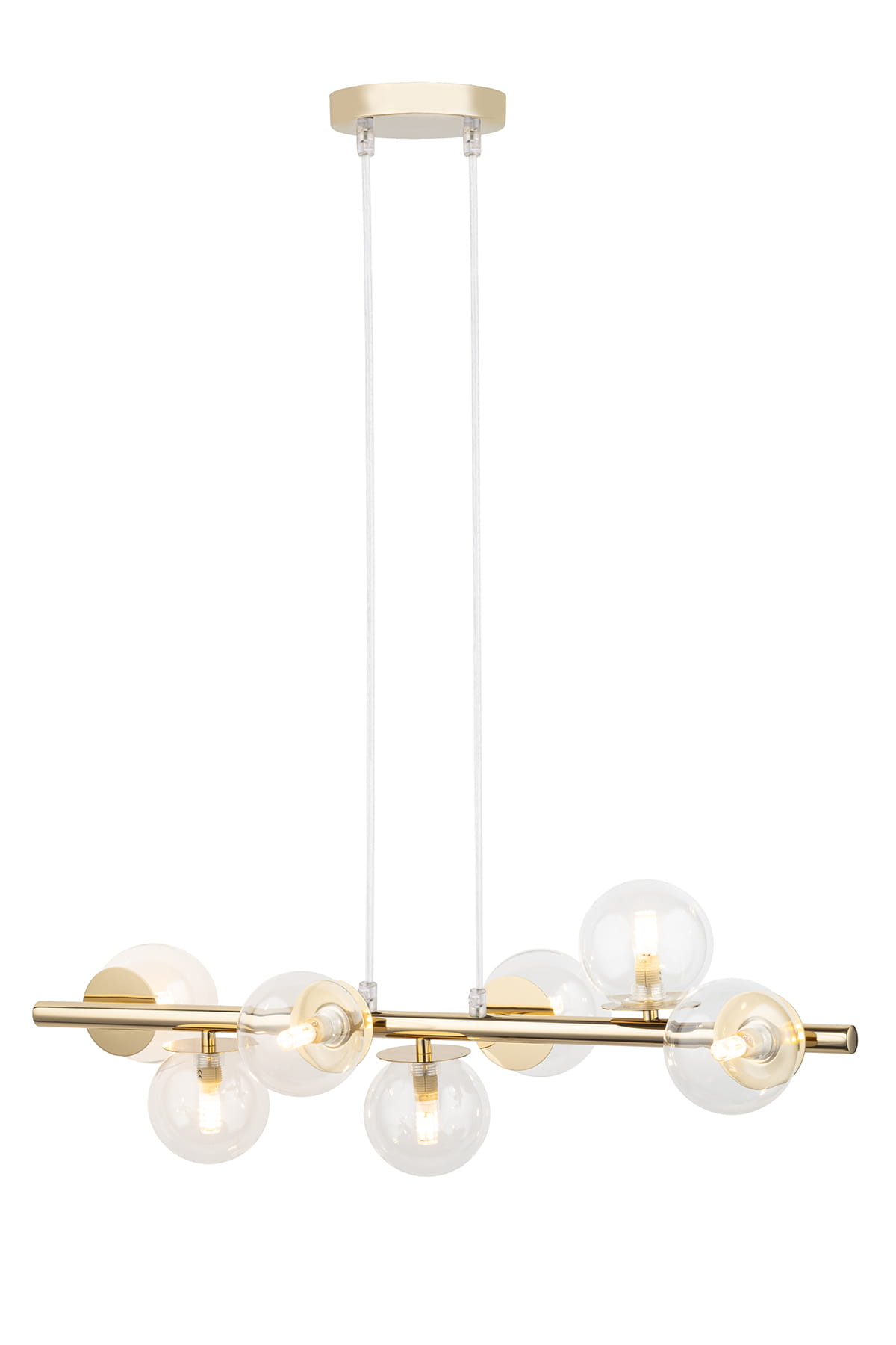 Lampa wisząca Avola z siedmioma źródłami światła G9, w złotej oprawie i przezroczystymi kloszami. Produkt zawieszony na dwóch przezroczystych linkach, z prostokątnym mocowaniem sufitowym. Klosze mają okrągły kształt.