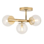 Lampa sufitowa Avola z trzema źródłami światła G9, w złotym wykończeniu z metalowymi elementami, posiada przezroczyste klosze w kształcie kul. Montowana na okrągłym stropie, z widocznymi żarówkami wewnątrz kloszy.