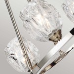 Lampa wisząca Rubin z czterema kloszami G9 wykonana z przezroczystego szkła w kształcie diamentu, zawieszona na metalowej konstrukcji w satynowym niklu. Klosze emitują ciepłe światło, tworząc elegancką atmosferę.