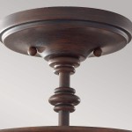 Lampa sufitowa Pickering w starym brązie, z trzema gniazdami E14. Widok z dołu, pokazujący dekoracyjne detale i teksturę metalowego mocowania oraz ozdobne elementy w kształcie pierścieni.