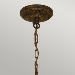 Lampa wisząca Drawing Room w postarzanym brązie z pięcioma miejscami na żarówki E27. Ujęcie z dołu, pokazujące ozdobny uchwyt i łańcuch. Widać detale tekstury i wykończenia.