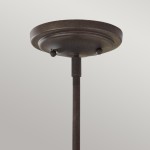 Lampa wisząca Urban Renewal S z żelaza w rustykalnym stylu. Ujęcie od dołu, ukazujące okrągły, płaski sufitowy element z dwoma przyciskami. Metaliczna, ciemna powierzchnia z delikatną fakturą, zawieszona na prostym, długim stelażu.