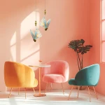 Lampa wisząca Mariposa w złotym kolorze z kloszami w kształcie motyli, wykonany z przezroczystego materiału z niebieskimi detalami. Zawieszona na cienkich linkach w nowoczesnym wnętrzu z pastelowymi fotelami i oświetleniem naturalnym.