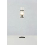 Lampa stołowa Tubo H65 z czarną podstawą i przezroczystym kloszem, stojąca na okrągłej podstawie. Klosz o cylindrycznym kształcie z pionowymi żłobieniami, zawiera miejsce na żarówkę E14. Produkt na białym tle, prezentowany frontalnie.