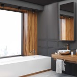 Czarna lampa sufitowa tuba Faro LP-6510/1SM BK, 1-punktowa, zamontowana na suficie w nowoczesnej łazience. Oświetlenie skierowane w dół, w towarzystwie drewnianych akcentów i minimalistycznych mebli. IP65, idealna do wilgotnych pomieszczeń.