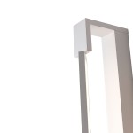 Biały kinkiet łazienkowy LED Flexia IP44, o prostokątnym kształcie, z wbudowanym źródłem światła. Ujęcie z boku, ukazujące górną część oraz delikatne oświetlenie. Wykonany z matowego materiału, idealny do nowoczesnych wnętrz.