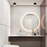 Czarna lampa sufitowa Kendal w formie tuby, z gniazdem GX53, montowana na suficie. Widoczna w aranżacji łazienkowej, w towarzystwie okrągłego lustra i minimalistycznych mebli. Oświetlenie o stopniu ochrony IP65, zapewniające odporność na wilgoć.