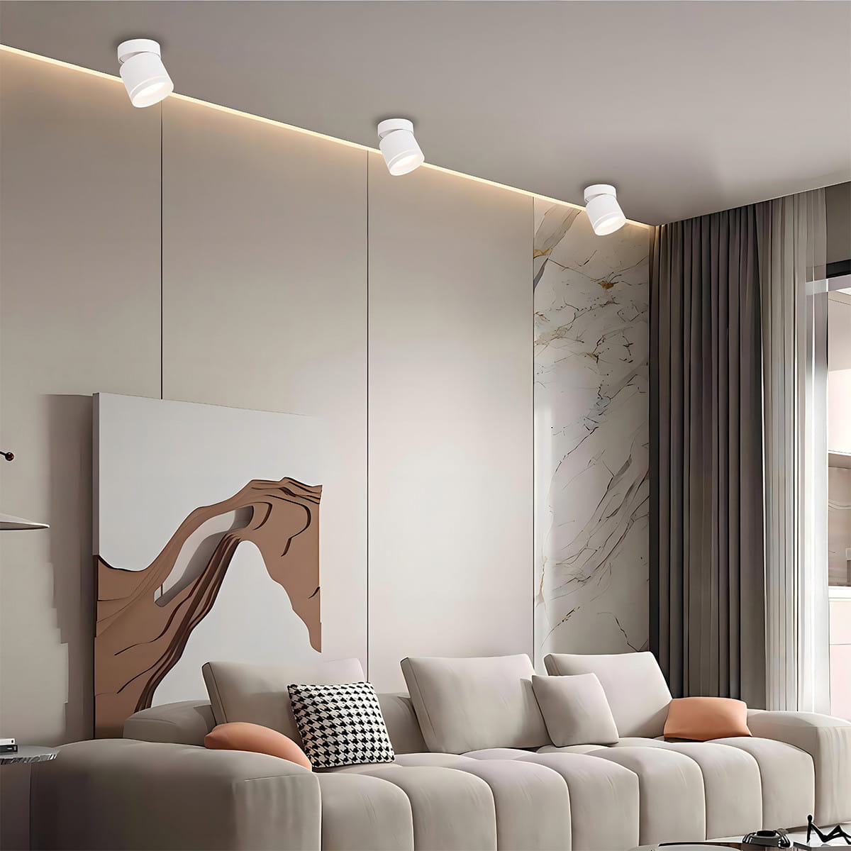 Biała lampa sufitowa Kendal (spot) 1xGX53, zamontowana na suficie, z ruchomym kloszem, o minimalistycznym designie. W tle jasne ściany i nowoczesny obraz, otoczenie w strefie wypoczynkowej.