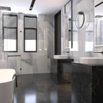 Kinkiet Ringa D40 w kolorze czarnym, z jedną diodą LED o mocy 20W i stopniu ochrony IP44. Zainstalowany w nowoczesnej łazience, na tle marmurowych płytek. Produkt zamontowany na ścianie, obok dwóch umywalek.