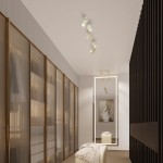 Beżowa lampa sufitowa Karbon (spot) z dwoma źródłami światła GU10, zamontowana na suficie w nowoczesnym wnętrzu. Lampa skierowana w dół, umieszczona w przestrzeni z szafami i lustrami, zapewnia oświetlenie aranżacji.