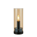 Post lampa stołowa z kloszem w kolorze bursztynowym, osadzona na czarnej podstawie. Kształt cylindryczny, z widoczną żarówką E14 w środku. Styl minimalistyczny, idealna do nowoczesnych wnętrz.