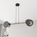 Lampa wisząca Xotic 2xE27 w kolorze czarnym, z metalowym stelażem i dekoracyjnymi okrągłymi kloszami z wycięciami. Zawieszona na dwóch cienkich linkach, w nowoczesnym stylu. Idealna do przestrzeni mieszkalnych.