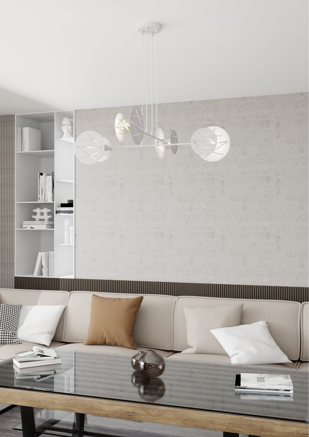 Lampa wisząca Xotic 4xE27 w białym kolorze, z metalowymi, okrągłymi kloszami ozdobionymi liśćmi. Zawieszona na cienkich linkach, umieszczona w nowoczesnym wnętrzu z sofą i stolikiem. Tło w jasnym odcieniu.
