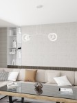 Lampa wisząca Euforia w kolorze białym, z dwoma źródłami światła E27, zawieszona na długich przewodach w nowoczesnym stylu. Produkt umieszczony w minimalistycznym wnętrzu z sofą i szklanym stolikiem.