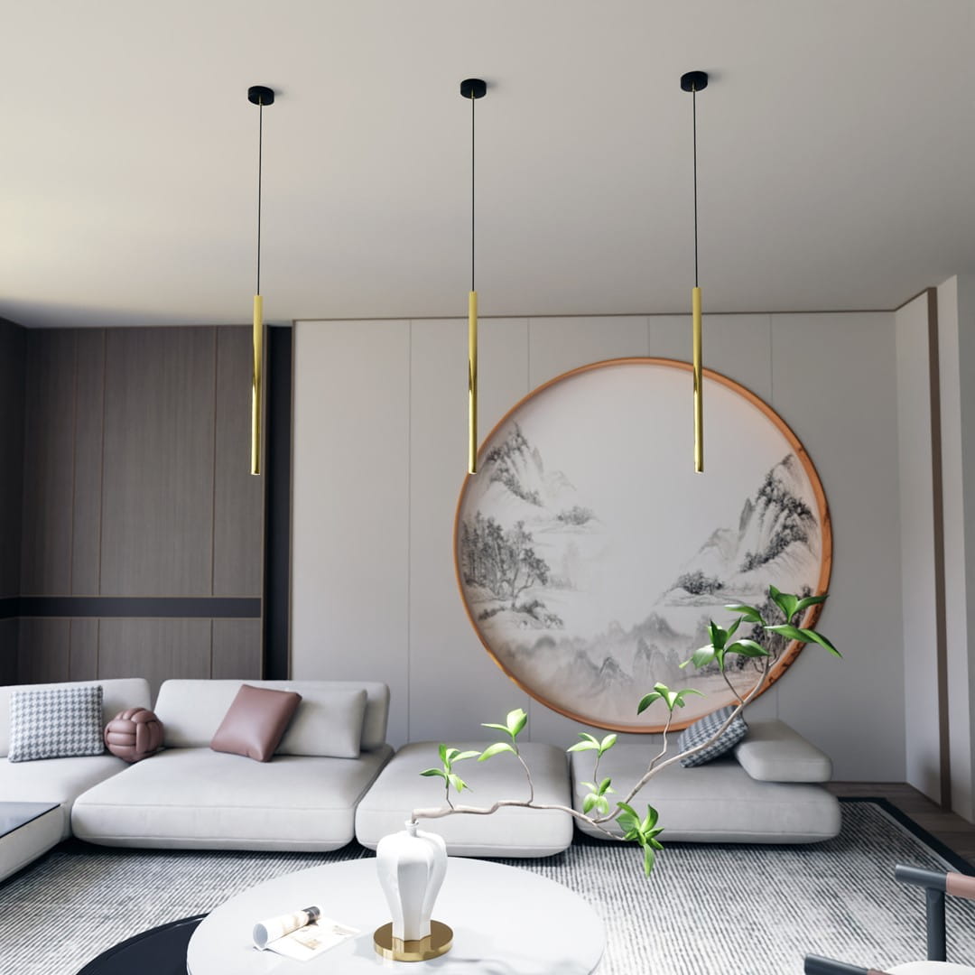 Lampa wisząca Selter 1xG9 w kolorze czarnym i złotym, o prostym, cylindrycznym kształcie. Zawieszona na cienkim przewodzie w nowoczesnym wnętrzu z jasnymi kanapami i okrągłym obrazem na ścianie. Idealna do minimalistycznych aranżacji.