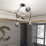 Lampa sufitowa Stardom 5xE14 w kolorze czarnym i grafitowym, z pięcioma okrągłymi kloszami w metalicznym wykończeniu. Zawieszona na okrągłej podstawie, w nowoczesnym wnętrzu, doskonale oświetla przestrzeń.