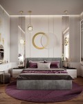 Lampa wisząca Spinner 19, złota, z jedną żarówką LED 7W, zawieszona w sypialni. W tle widoczna elegancka aranżacja z łóżkiem, poduszkami w odcieniach szarości i fioletu oraz okrągłym dywanem. Lampa ma nowoczesny, minimalistyczny design.