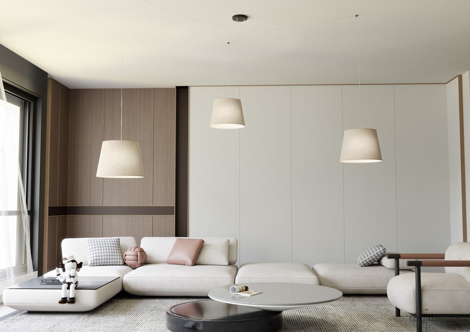 Lampa wisząca Ascot 3xE27 w kolorze czarnym i beżowym, z trzema kloszami w kształcie stożka, zawieszona na cienkich linkach. Produkt znajduje się w nowoczesnym wnętrzu z jasnymi meblami i drewnianymi akcentami.