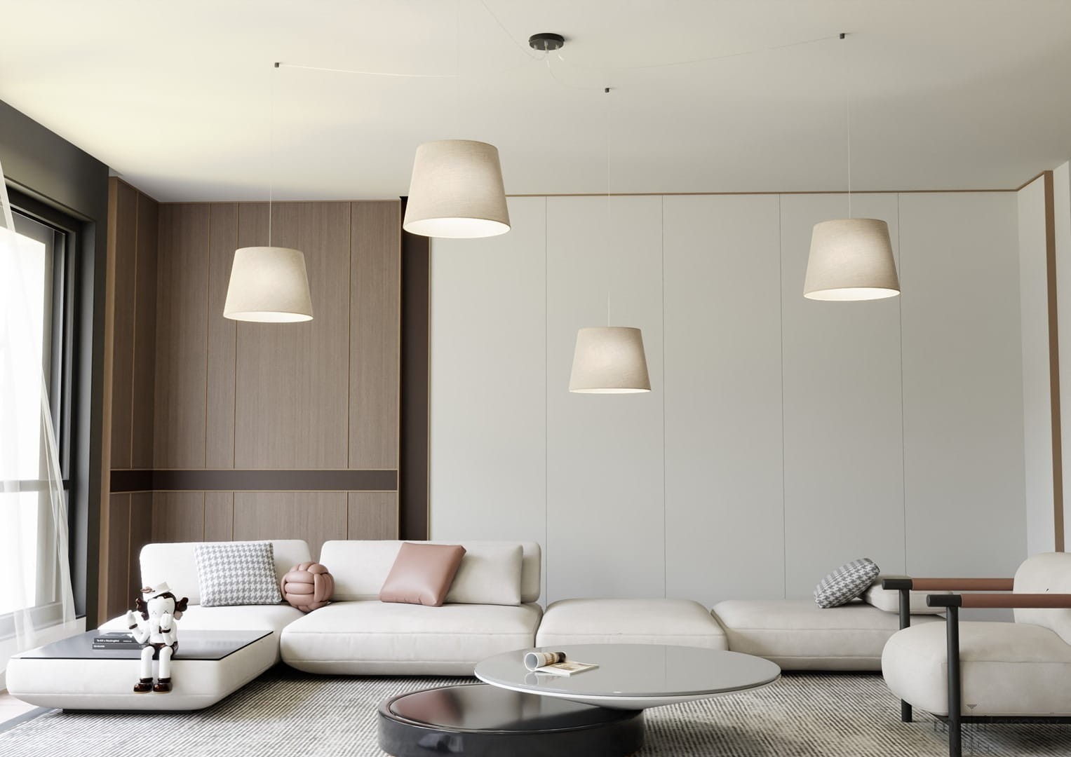 Lampa wisząca Ascot 4xE27 w kolorze czarnym i beżowym, z miękkim abażurem w kształcie stożka, zawieszona w nowoczesnym wnętrzu. Widoczne trzy lampy w równych odstępach, nad jasną sofą i okrągłym stołem. Tło w odcieniach szarości i drewna.