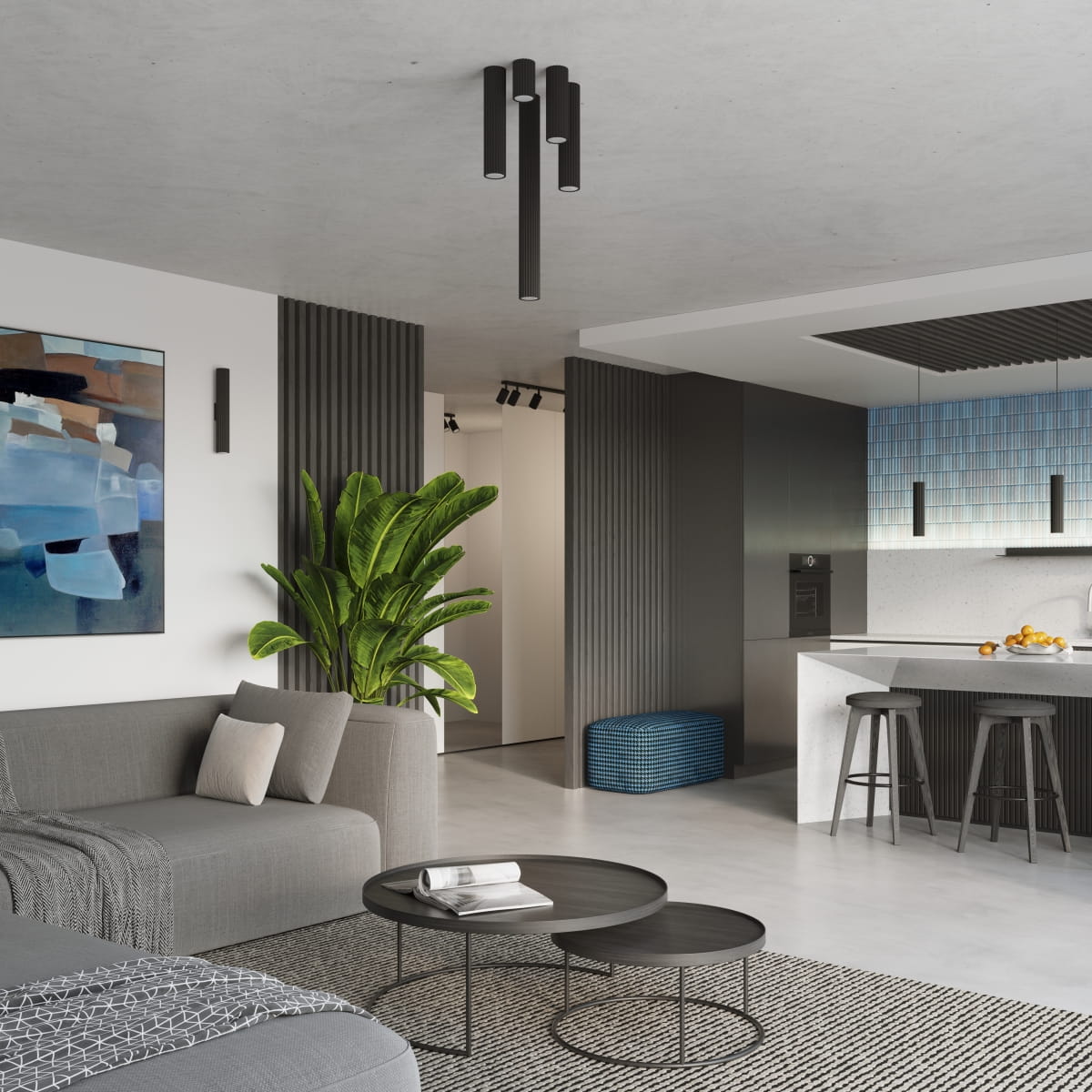 Czarna lampa sufitowa Karbon 40 z jednym źródłem światła GU10, zawieszona na suficie w nowoczesnym wnętrzu. Widoczna w otoczeniu szarej kanapy, stolika kawowego oraz rośliny, w minimalistycznej kuchni z jasnym blatem.