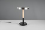 Lampa stołowa Celeste z 1xLED/10W, czarna podstawa okrągła, drewniany trzon, metalowa klosz w kolorze przydymionym. Ujęcie frontalne, stojąca na jednolitym tle, widoczny kabel zasilający.