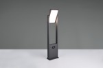 Lampa ogrodowa Malawi H61 w kolorze antracytowym, z czujnikiem ruchu. Wysoka, prostokątna konstrukcja z LED 5W, IP65. Ujęcie frontalne, lampa stoi na białym blacie, z włączonym źródłem światła. W dolnej części widoczny czujnik.