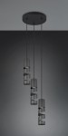 Lampa wisząca Stream w kolorze czarnym z trzema oprawami GU10. Cylindryczne klosze z wycięciami na przewodach w różnych wysokościach, zawieszone na cienkich linkach, montowane do sufitowej podstawy okrągłej. Tło w odcieniach szarości.