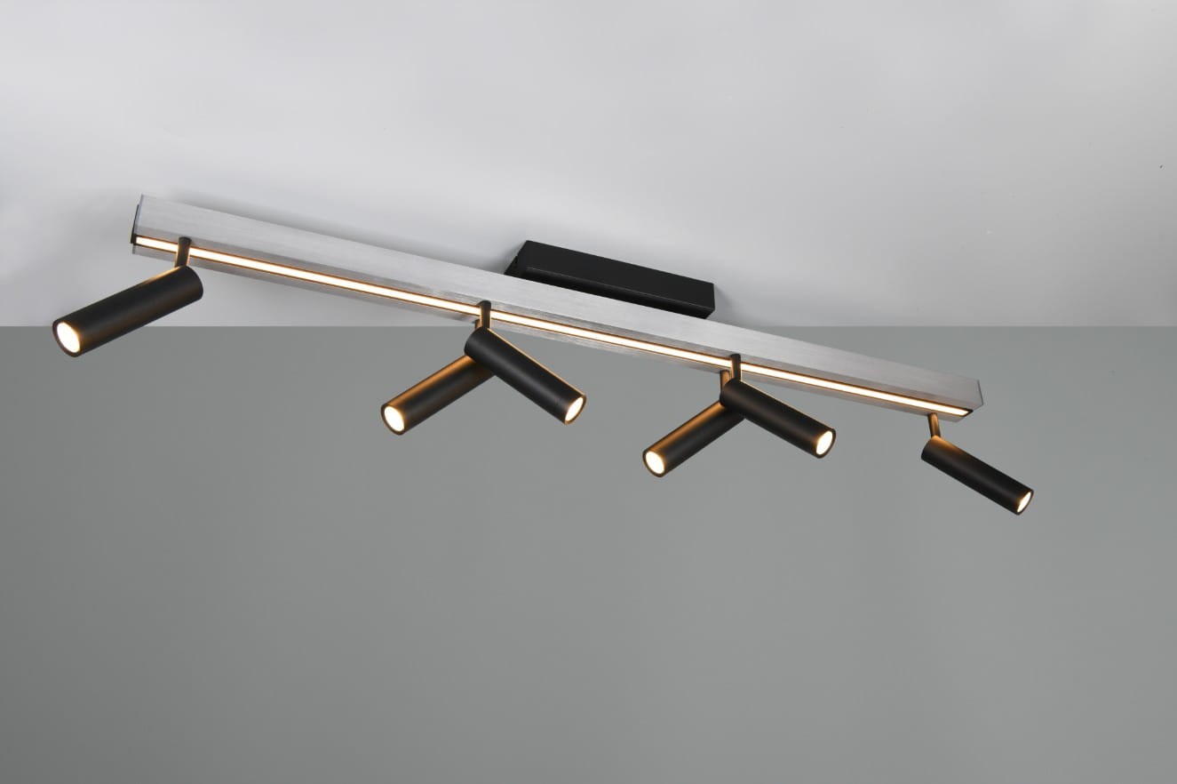 Lampa sufitowa Zeno z pilotem, składająca się z sześciu czarnych reflektorów LED na aluminiowej szynie. Reflektory mają okrągłe końcówki, a całość zamontowana jest na czarnej podstawie. Lampa emituje światło w różnych odcieniach dzięki funkcji CCT.