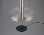 Lampa podłogowa Gomez w kolorze tytanowym, bezprzewodowa, z jedną diodą LED 3W. Widoczna okrągła podstawa z matowego metalu oraz czarna płytka ładująca z kablem. Produkt ustawiony w pozycji stojącej, z detalem na podstawie i górnej części lampy.