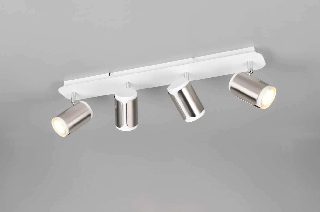 Lampa sufitowa Gillan w kolorze białym i niklowym, z czterema reflektorami GU10. Ułożona poziomo, z metalowymi kloszami o cylindrycznym kształcie. Umożliwia skierowanie światła w różnych kierunkach, montowana na suficie.