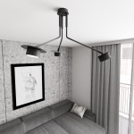 Czarna lampa sufitowa Mizu z trzema reflektorami GX53, umieszczona w nowoczesnym wnętrzu. Lampa ma minimalistyczny design z metalowymi ramionami, skierowanymi w różnych kierunkach, w tle widoczna szara ściana i kanapa z poduszką.
