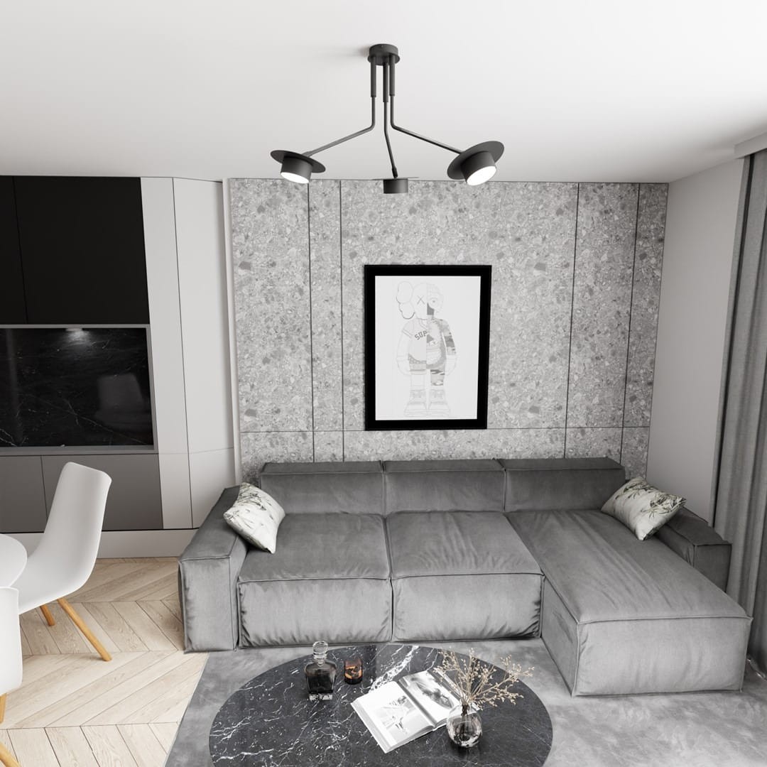Lampa sufitowa Mizu 3xGX53 w kolorze czarnym, z trzema ruchomymi ramionami. Montowana na suficie, idealna do nowoczesnych wnętrz. Widoczna w aranżacji z szaro-beżową sofą, okrągłym stołem i dekoracyjnymi elementami.