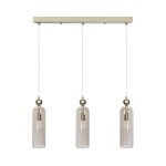 Lampa wisząca Regina z trzema kloszami E14 w kolorze złotym. Klosze mają cylindryczny kształt, wykonane z przezroczystego szkła z pionowymi żłobieniami. Lampa zawieszona na białych linkach, montowana na prostokątnej podstawie.