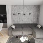 Lampa wisząca Sora czarna z czterema źródłami światła GX53, zawieszona nad szarym narożnym kanapą w nowoczesnym wnętrzu. Widoczna betonowa ściana w tle, stół z marmurowym blatem oraz dekoracje na stole.