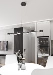 Lampa wisząca Megara w kolorze czarnym z sześcioma oprawami GX53, zawieszona na dwóch cienkich linkach. Produkt umiejscowiony nad okrągłym białym stołem w nowoczesnej kuchni, w tle widoczna szara ściana i sprzęt AGD.