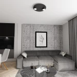 Czarna lampa sufitowa Bolx z dwoma źródłami światła GX53, zamontowana na suficie. Prosta, okrągła forma z metalicznym wykończeniem, idealna do nowoczesnych wnętrz. W tle widoczny szary narożnik i okrągły stół.